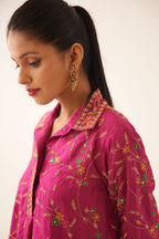 Jazz berry A-line short silk kurta set with all over embroidery, highlighted with sequins and bead work, paired with Jaz berry silk straight pants with dori and silk thread embroidery.