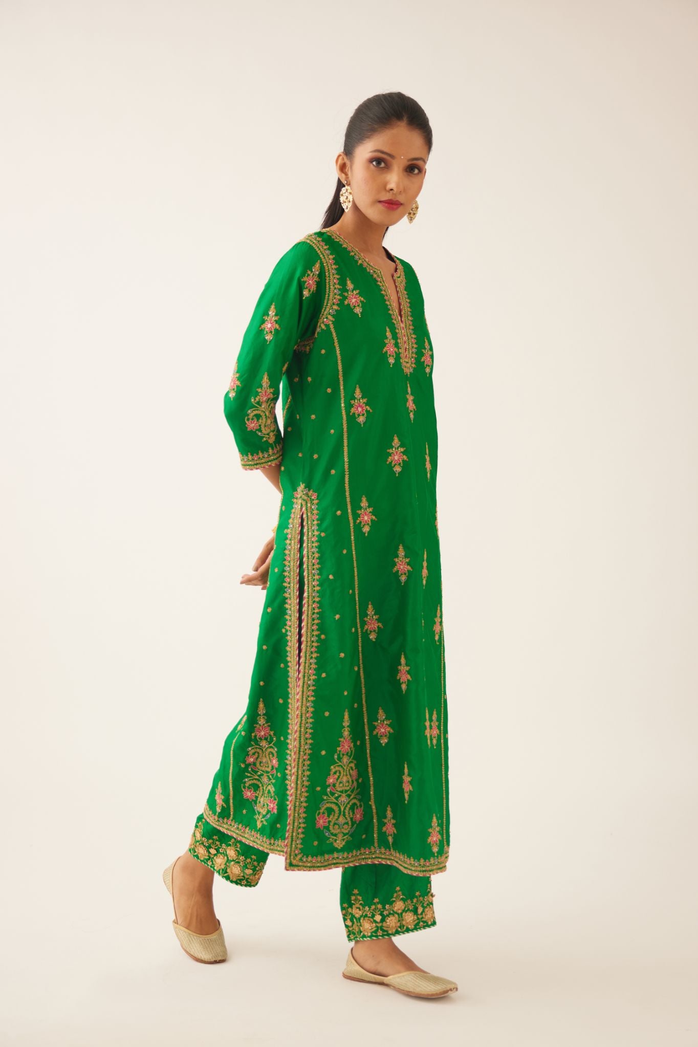 Green silk kalidar straight kurta set with dori and silk thread embroidery, highlighted with bead and sequins work.