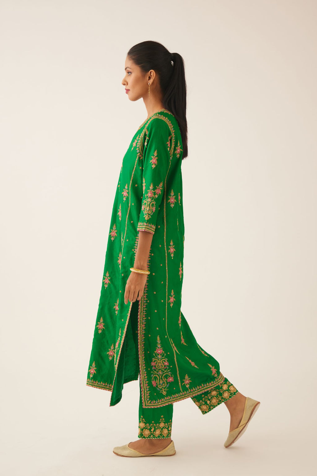 Green silk kalidar straight kurta set with dori and silk thread embroidery, highlighted with bead and sequins work.