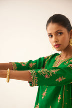Green silk kalidar straight kurta set with dori and silk thread embroidery, highlighted with bead and sequins work.
