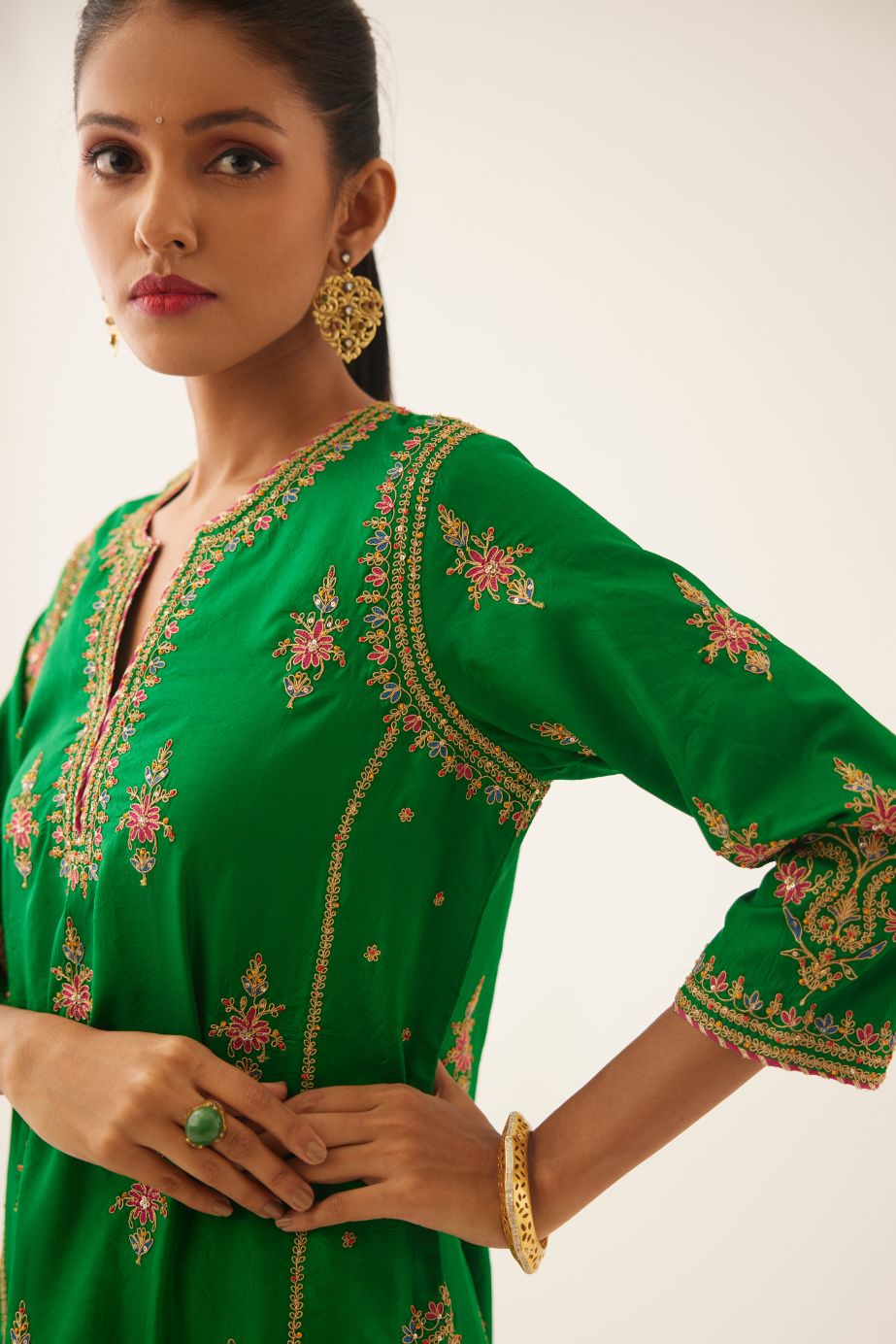 Green silk kalidar straight kurta set with dori and silk thread embroidery, highlighted with bead and sequins work.