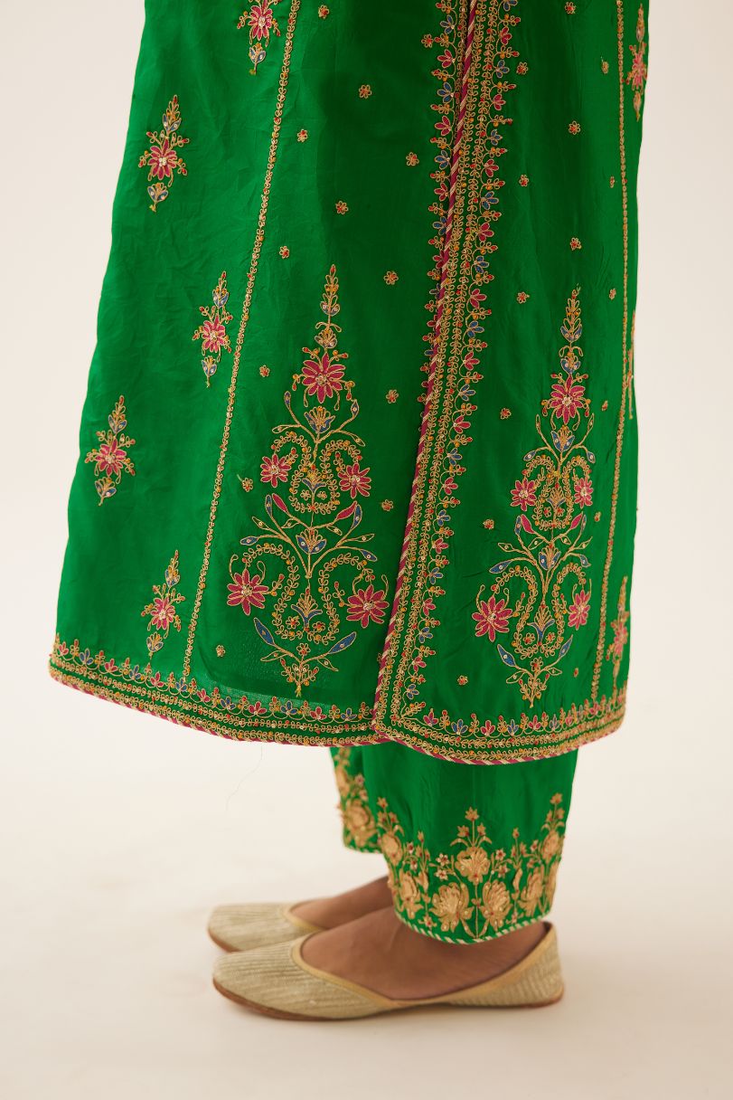 Green silk kalidar straight kurta set with dori and silk thread embroidery, highlighted with bead and sequins work.