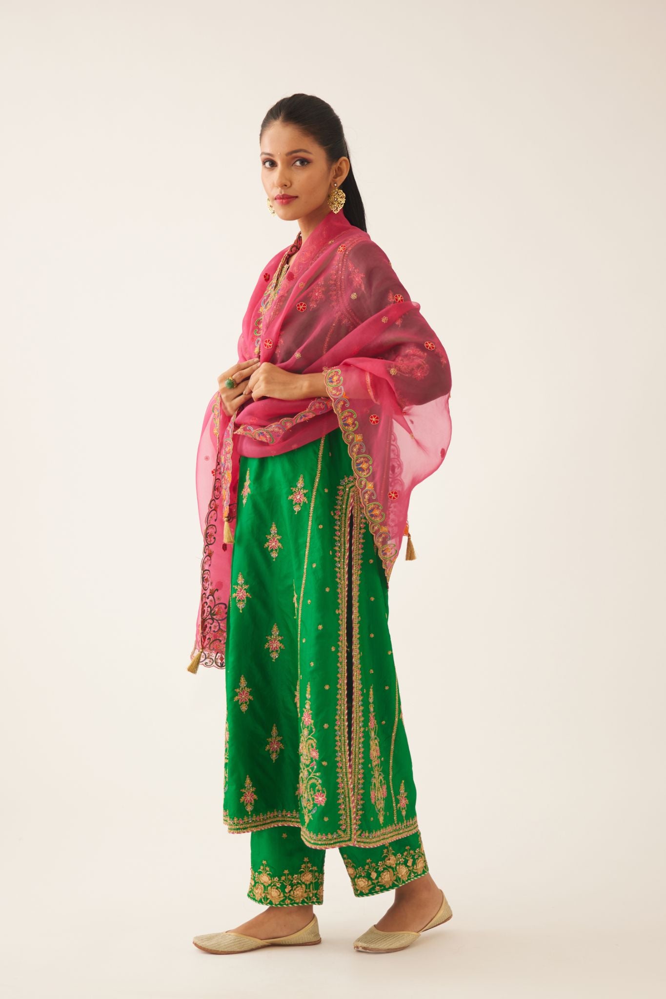 Green silk kalidar straight kurta set with dori and silk thread embroidery, highlighted with bead and sequins work.