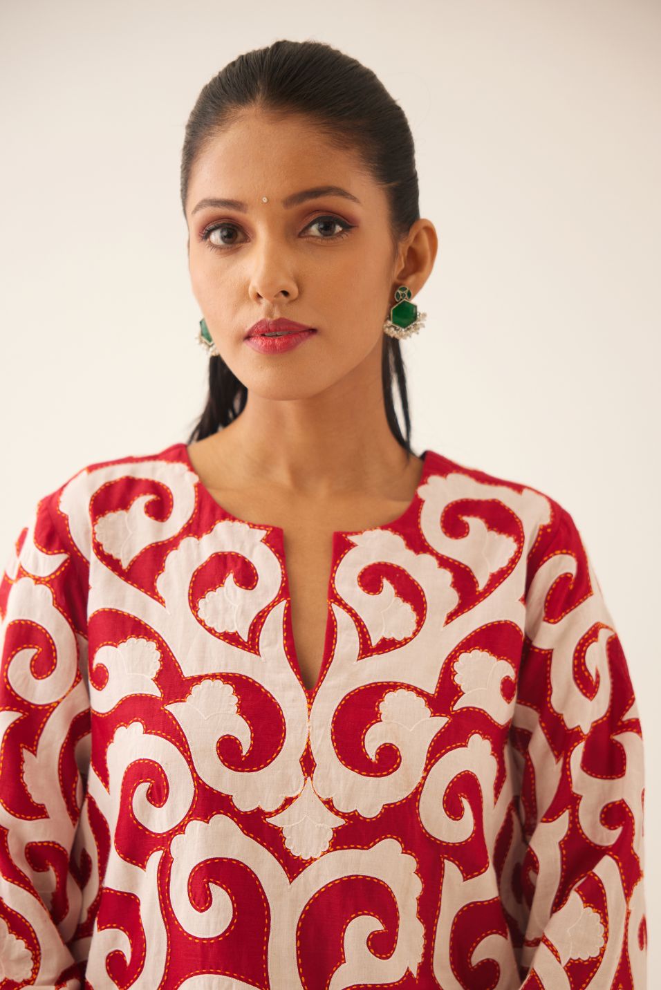 Red short easy fit, straight hem kurta set with all-over trellis jaal appliqué, highlighted with kantha work.