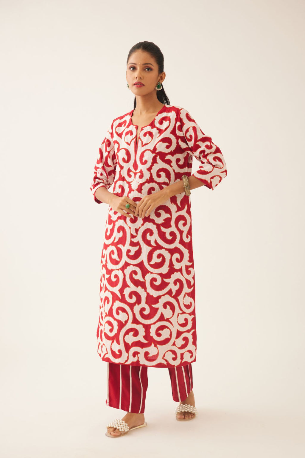 Red silk chanderi straight kurta set with all-over cotton appliqué trellis jaal, highlighted with kantha work.
