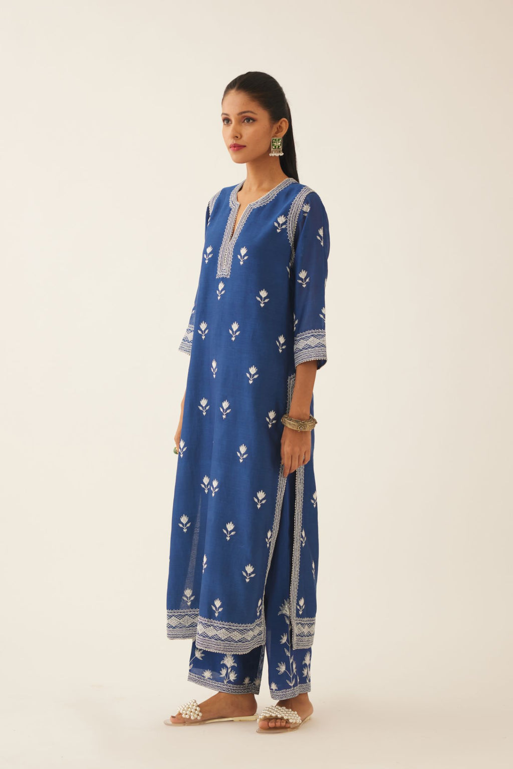 Blue silk chanderi straight kurta set with all over off white silk thread embroidery.