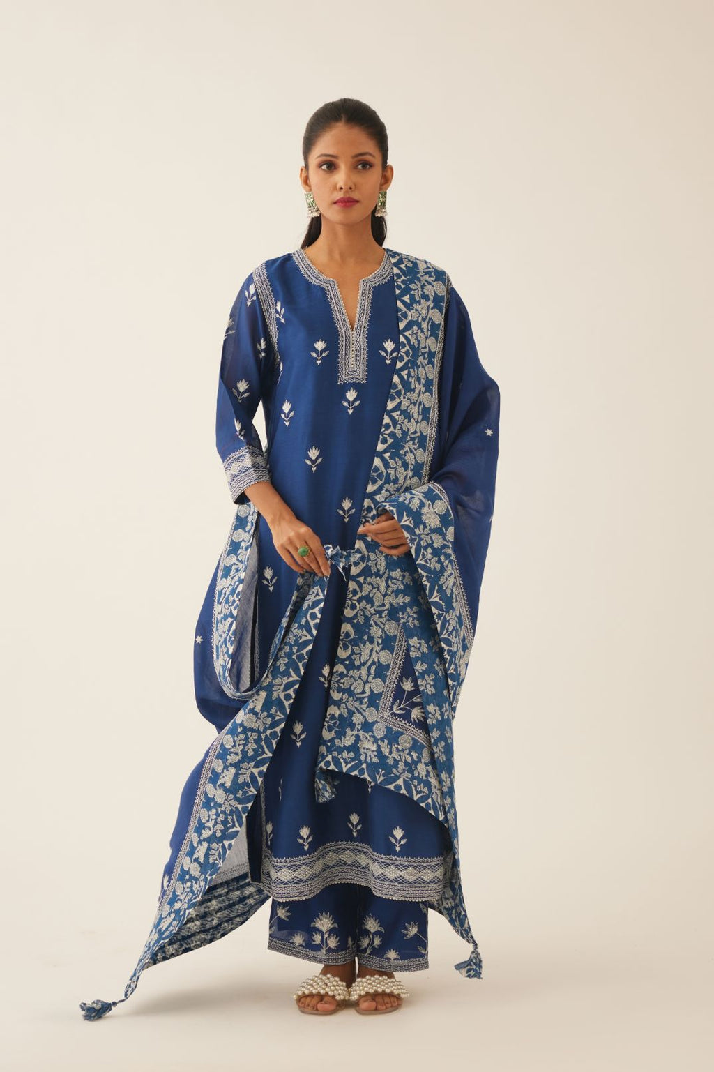 Blue silk chanderi dupatta highlighted with all-over off white thread embroidery and mixed printed border running along all edges.