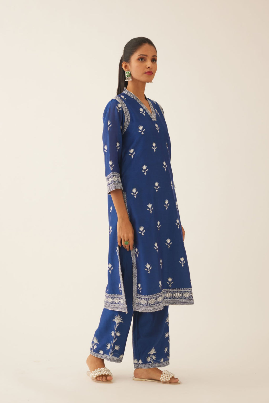 Blue silk chanderi mid length straight kurta set  with all over off white silk thread embroidery.