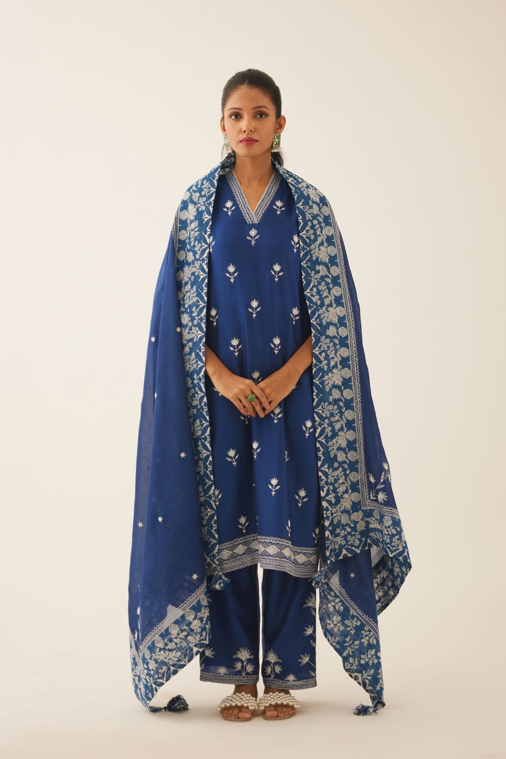 Blue silk chanderi mid length straight kurta set  with all over off white silk thread embroidery.