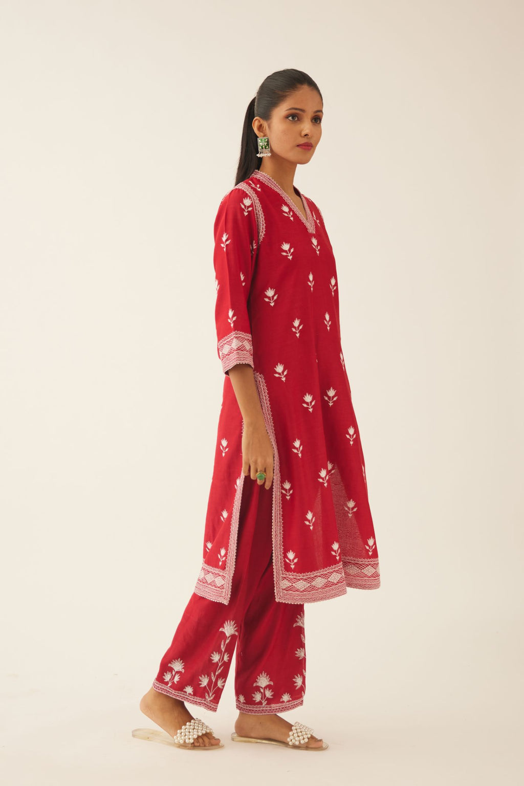 Red silk chanderi mid length straight kurta set with all over off white silk thread embroidery.