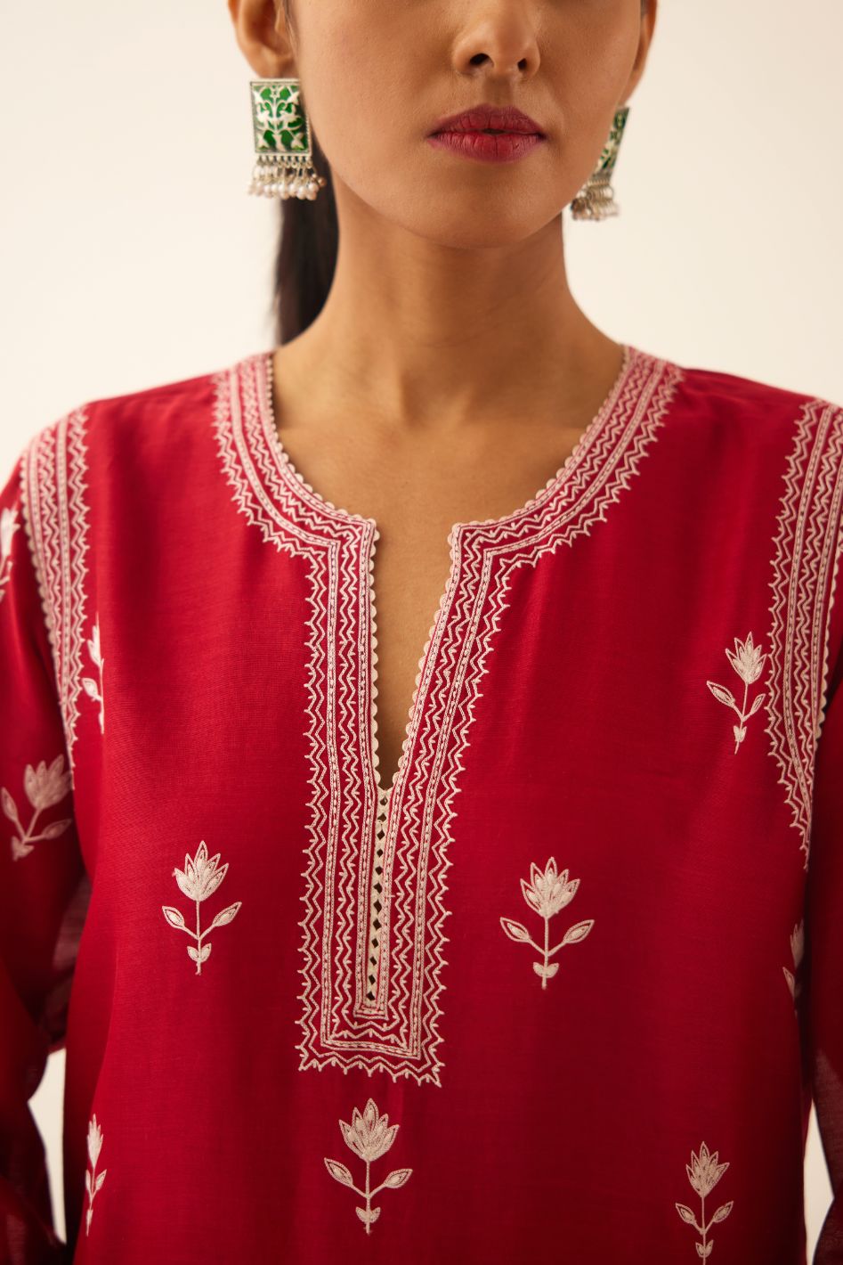 Red silk chanderi straight kurta set with all over off white silk thread embroidery.
