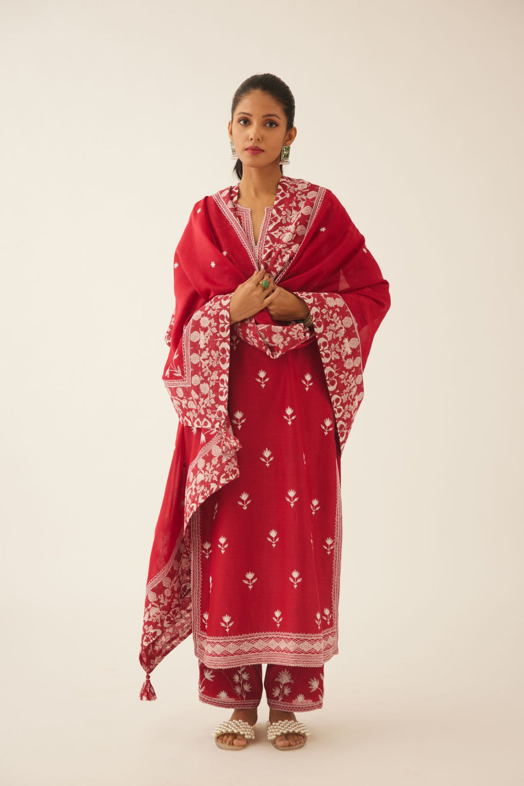 Red silk chanderi straight kurta set with all over off white silk thread embroidery.