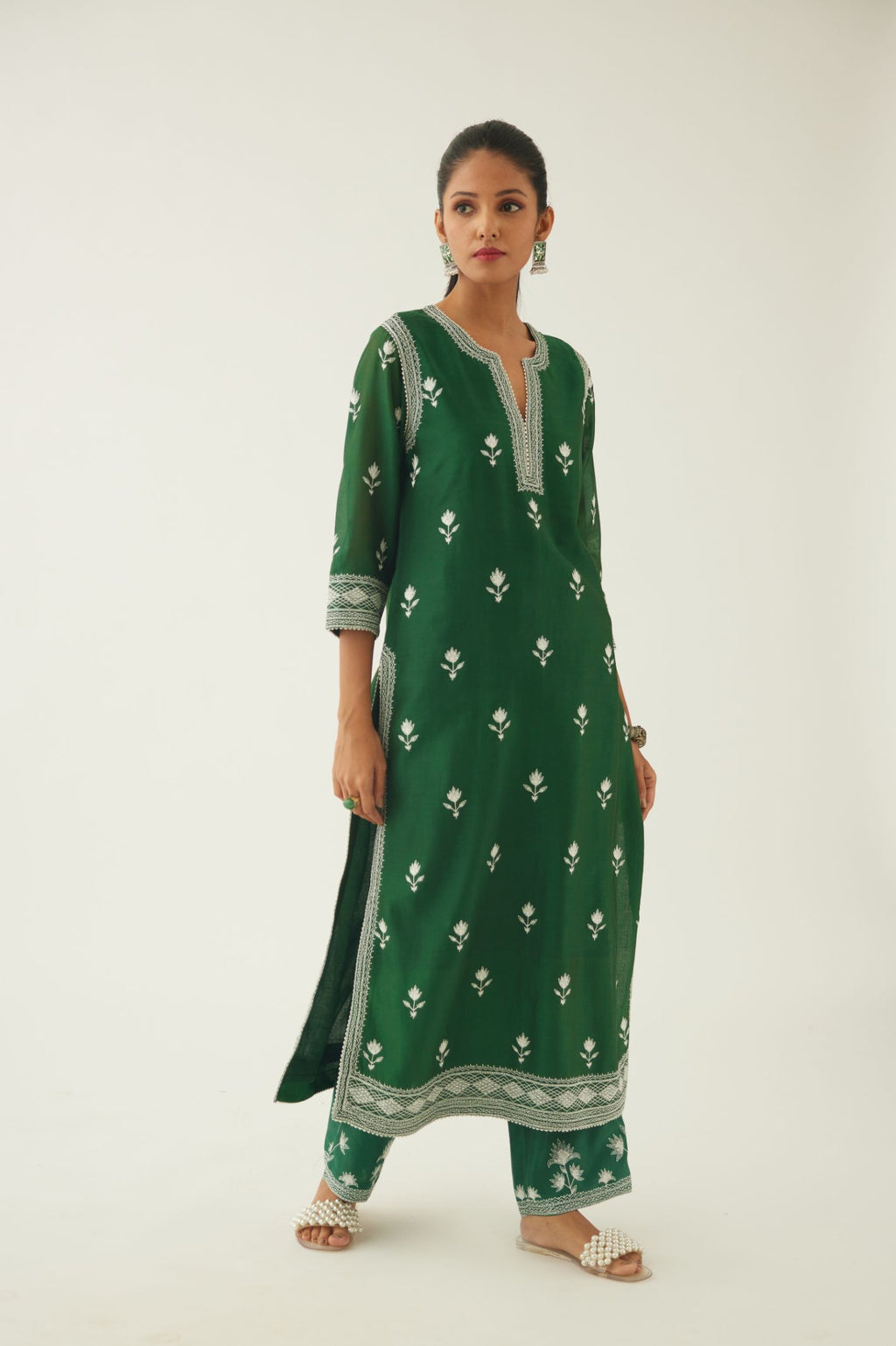 Green silk chanderi straight kurta set with all over off white silk thread embroidery.