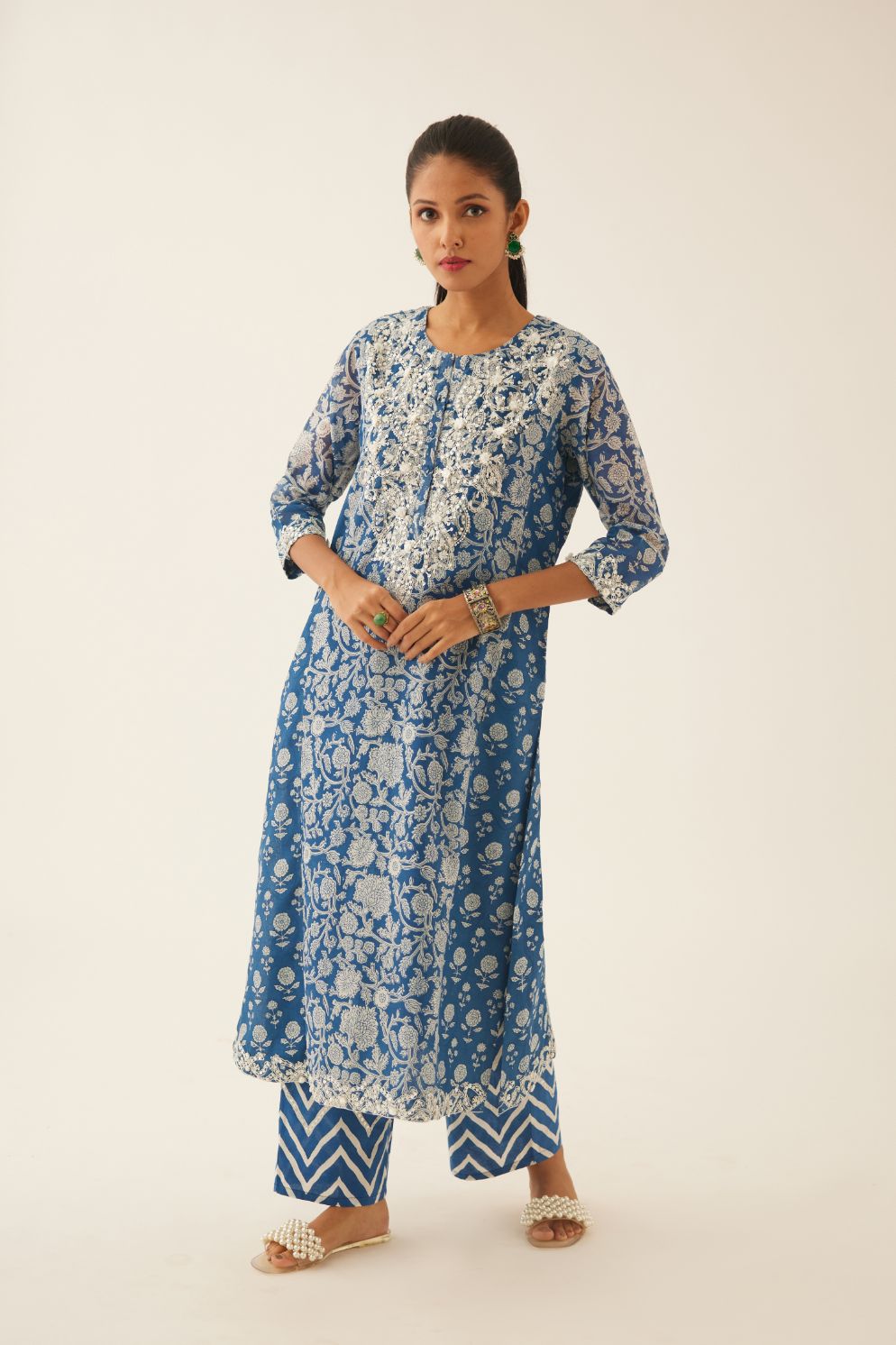 Blue hand block printed kalidar straight kurta set, highlighted with sequin, tassels & bead work.