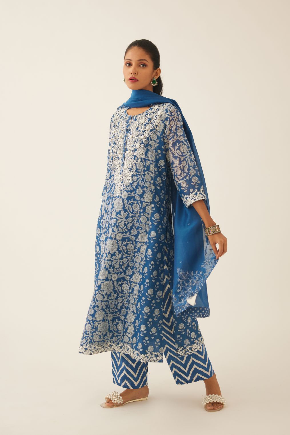 Blue hand block printed kalidar straight kurta set, highlighted with sequin, tassels & bead work.