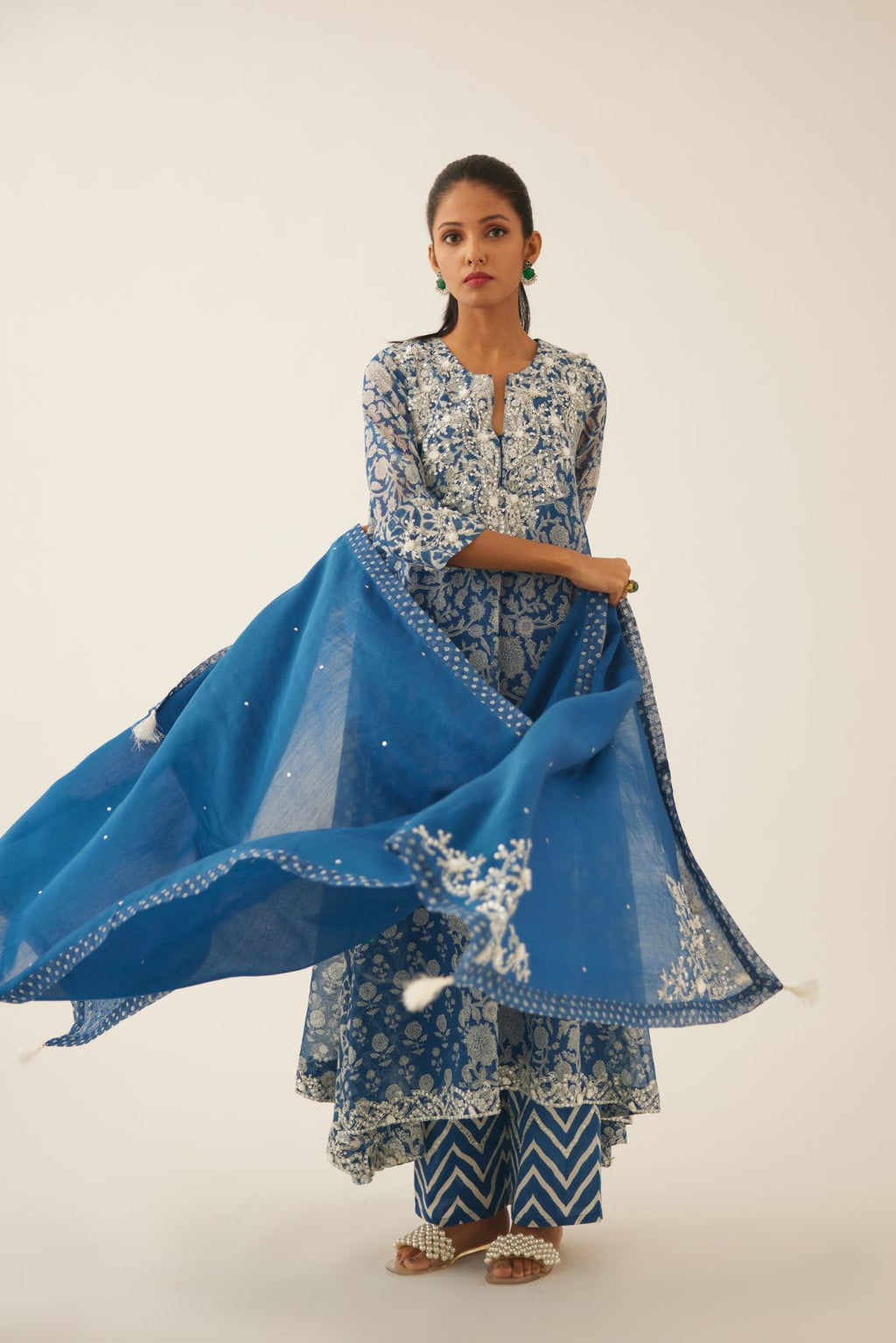 Blue silk chanderi dupatta highlighted with sequin, tassels and bead work boota at corners and printed border running along all edges.