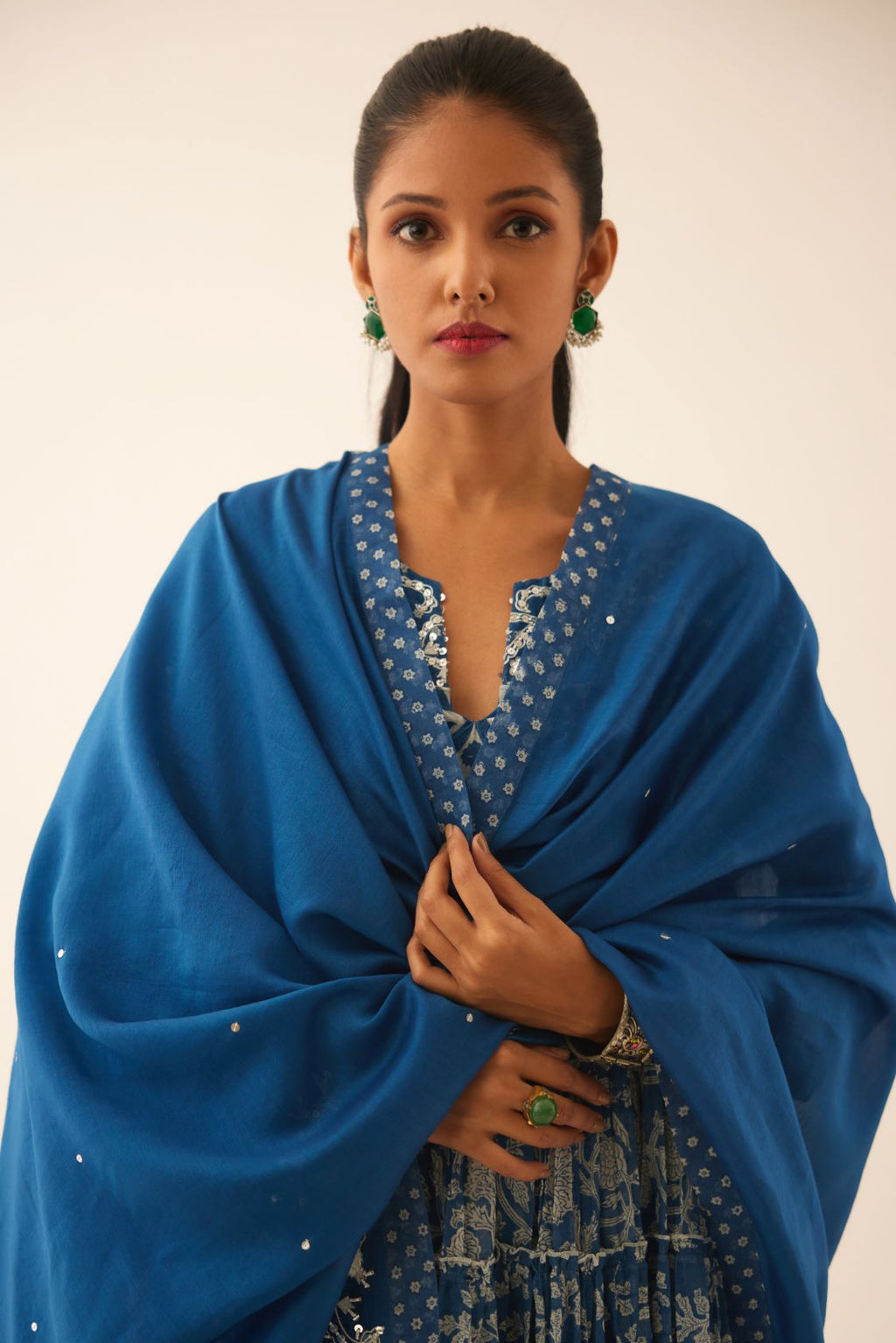 Blue hand block printed multi-tiered kurta dress set with 3/4 sleeves, highlighted with sequins, tassels and bead work.