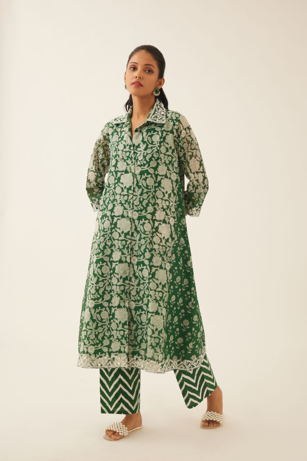Green hand block printed A-line short kurta with sequins, tassels and bead work, paired with green & off white cotton hand block printed straight pants detailed with sequin and bead work at hem.