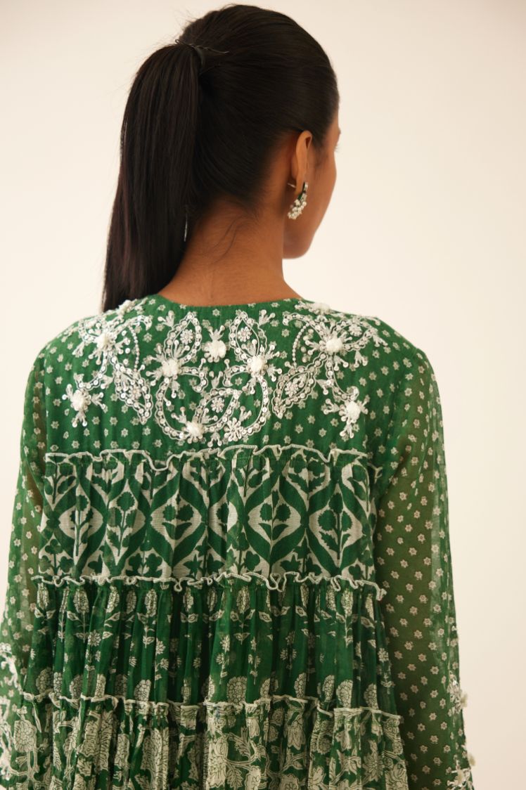 Green hand block printed multi-tiered kurta dress set with 3/4 sleeves, highlighted with sequins, tassels and bead work.