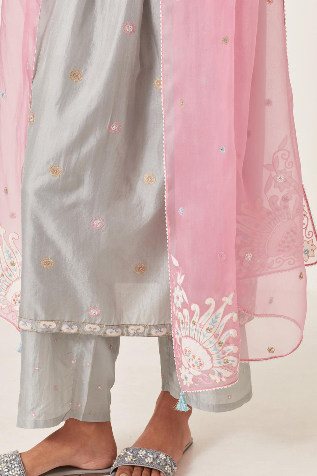 Pink silk organza dupatta with appliqué work and multi colored flower embroidery all-over the dupatta.