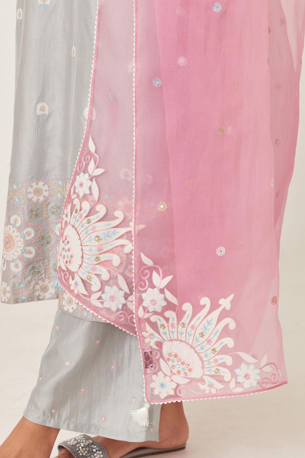 Pink silk organza dupatta with appliqué work and multi colored flower embroidery all-over the dupatta.