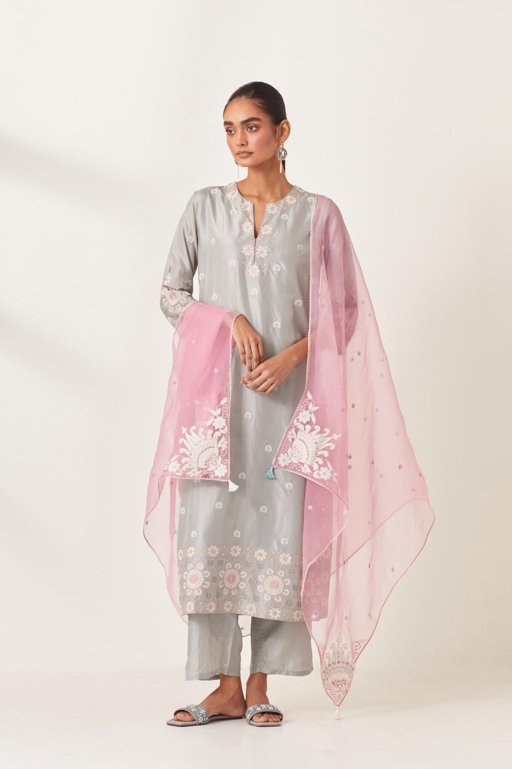 Pink silk organza dupatta with appliqué work and multi colored flower embroidery all-over the dupatta.