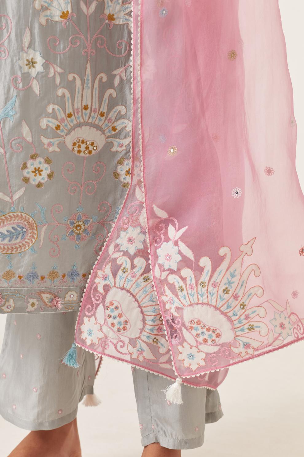 Pink silk organza dupatta with appliqué work and multi colored flower embroidery all-over the dupatta.