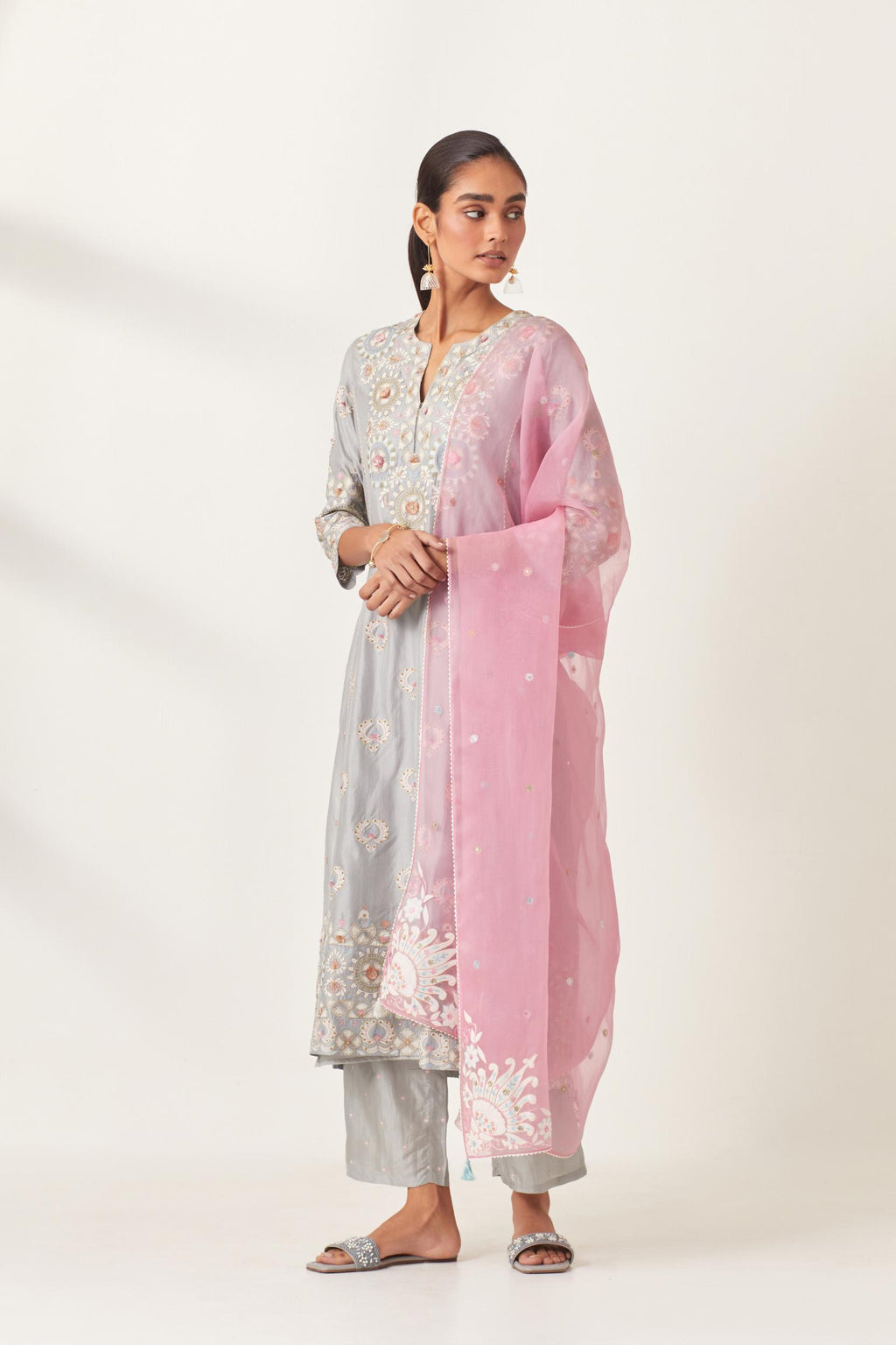 Blue kalidar straight kurta set, fully embroidered with appliqué flowers, multi-colored aari threadwork and silk tassels.