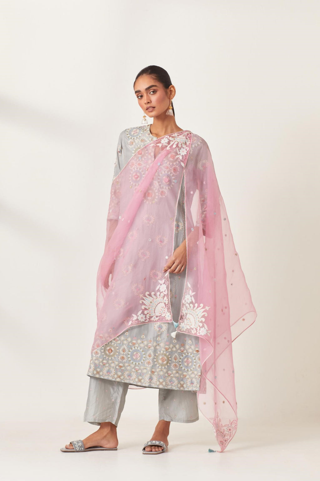 Blue kalidar straight kurta set, fully embroidered with appliqué flowers, multi-colored aari threadwork and silk tassels.