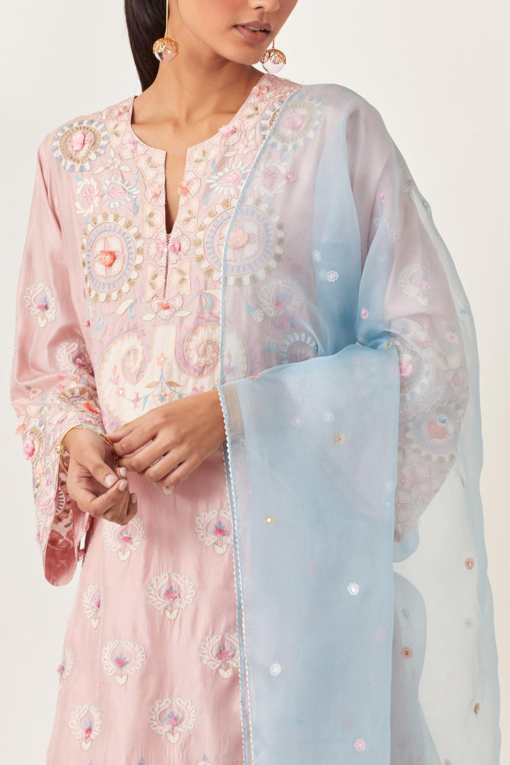 Pink silk straight hem mid-length abha style kurta set with bold appliqué embroidery along with multi-colored aari thread work and tassels.