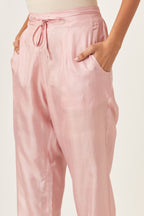 Pink silk straight pants detailed with quilted multi colored embroidery at bottom.