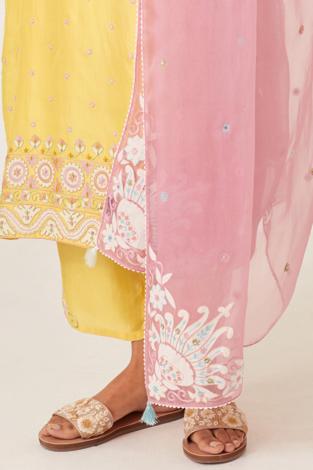 Pink silk organza dupatta with appliqué work and multi colored flower embroidery all-over the dupatta.