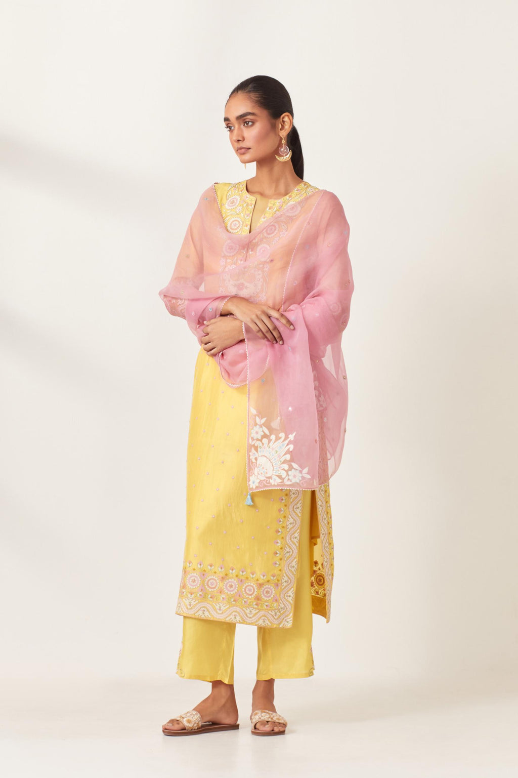 Pink silk organza dupatta with appliqué work and multi colored flower embroidery all-over the dupatta.