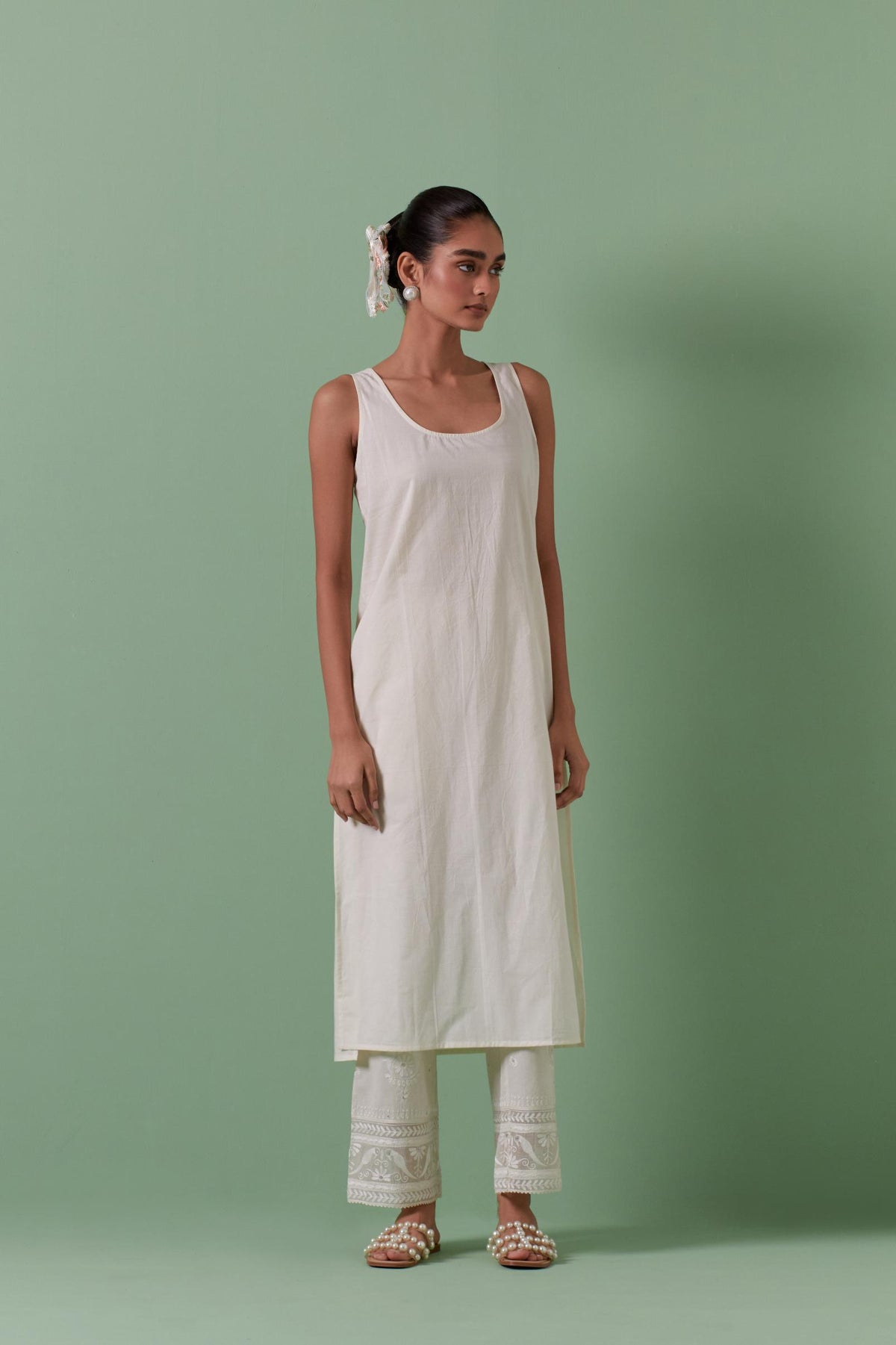 Off-white cotton chanderi straight kurta set with all over patchwork, silk thread, mirror, tassels embroidery and sequins.