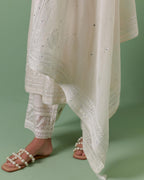 Off-white cotton chanderi dupatta with delicate silk thread embroidery, highlighted with braids, mirrors and sequins.