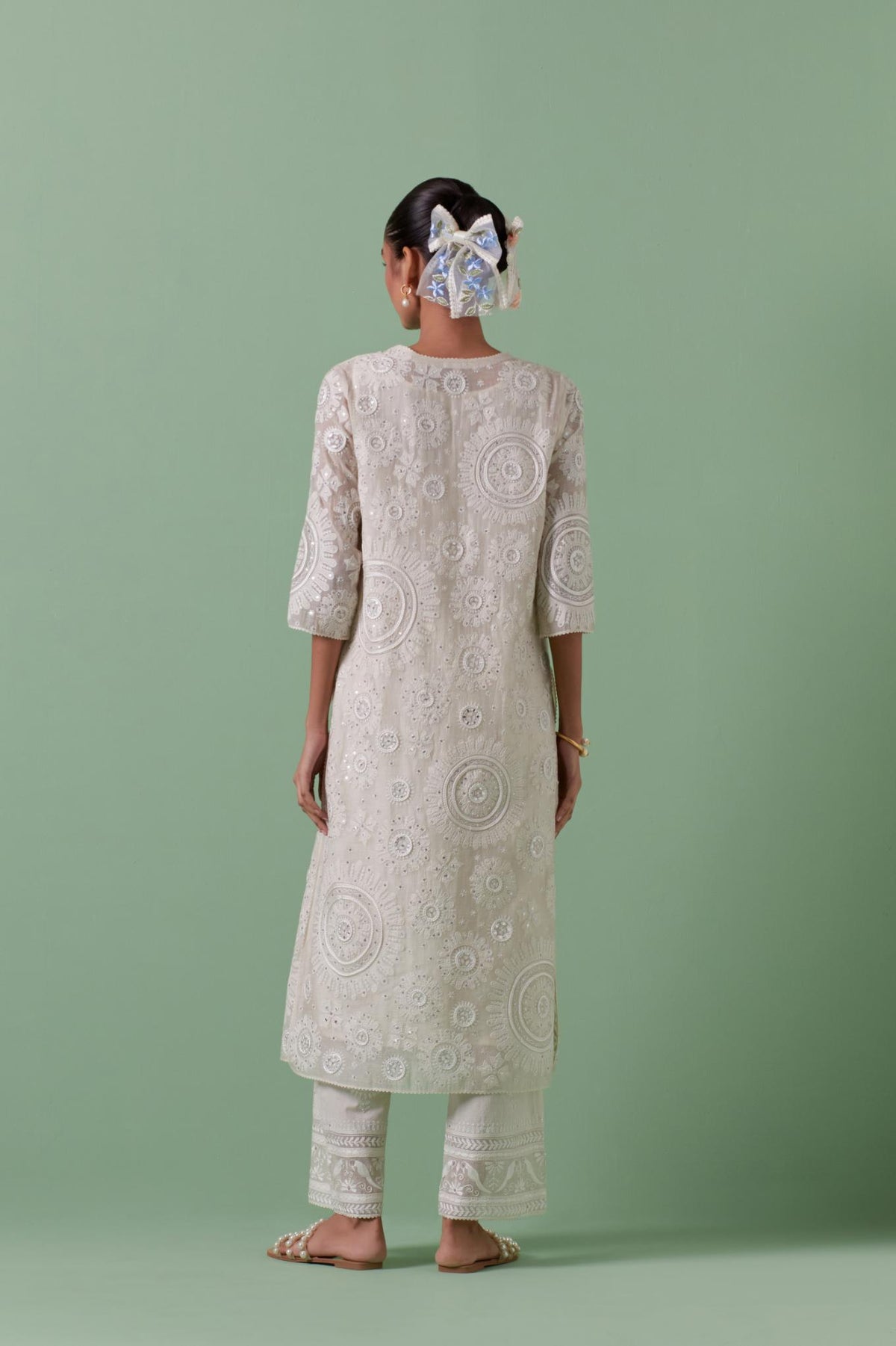 Off-white cotton chanderi straight kurta set with all over patchwork, silk thread, mirror, tassels embroidery and sequins.