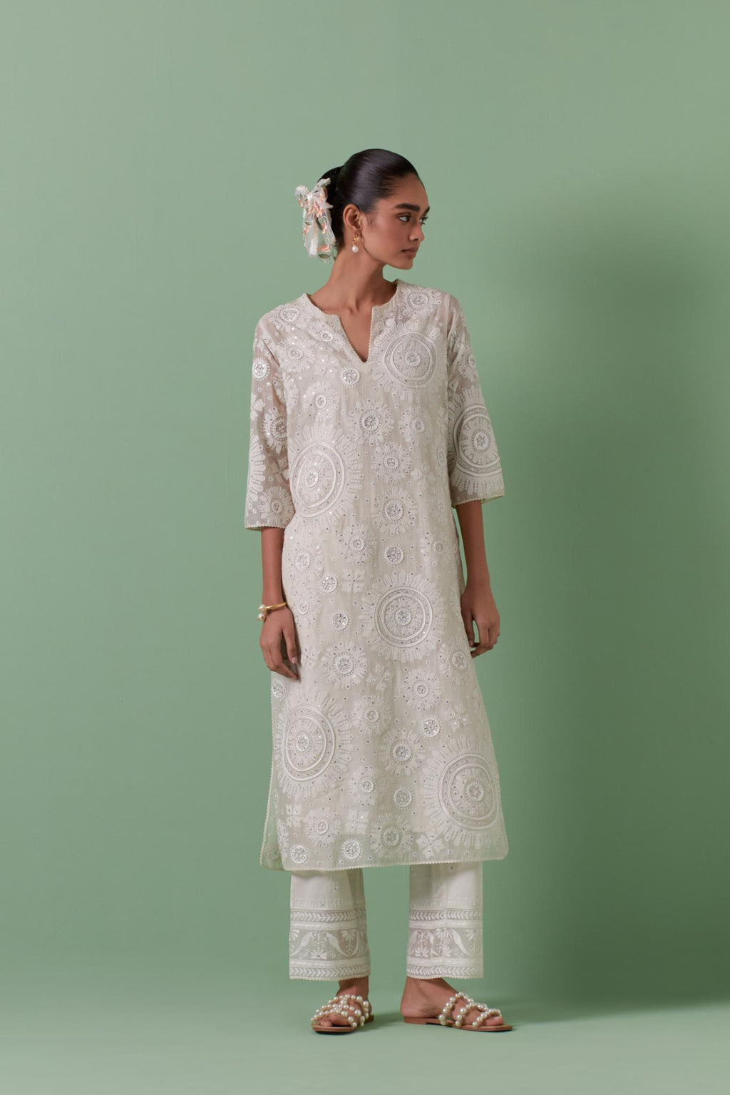Off-white cotton chanderi straight kurta set with all over patchwork, silk thread, mirror, tassels embroidery and sequins.
