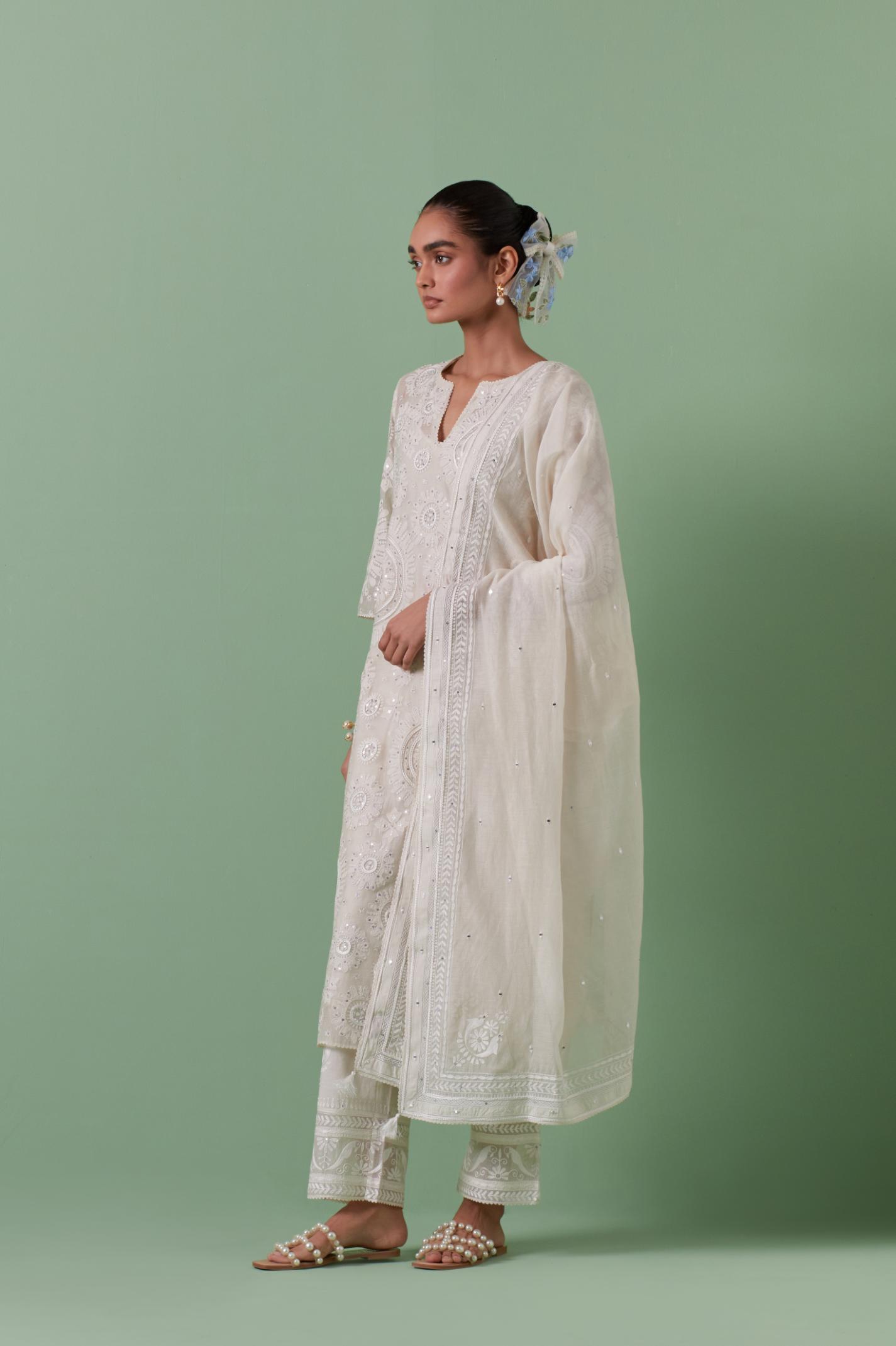 Off-white cotton chanderi dupatta with delicate silk thread embroidery, highlighted with braids, mirrors and sequins.