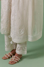 Off-white cotton chanderi dupatta with delicate silk thread embroidery, highlighted with braids, mirrors and sequins.