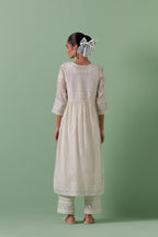 Off-white cotton chanderi embroidered kurta set dress with V neck, yoke and fine gathers at empire line.