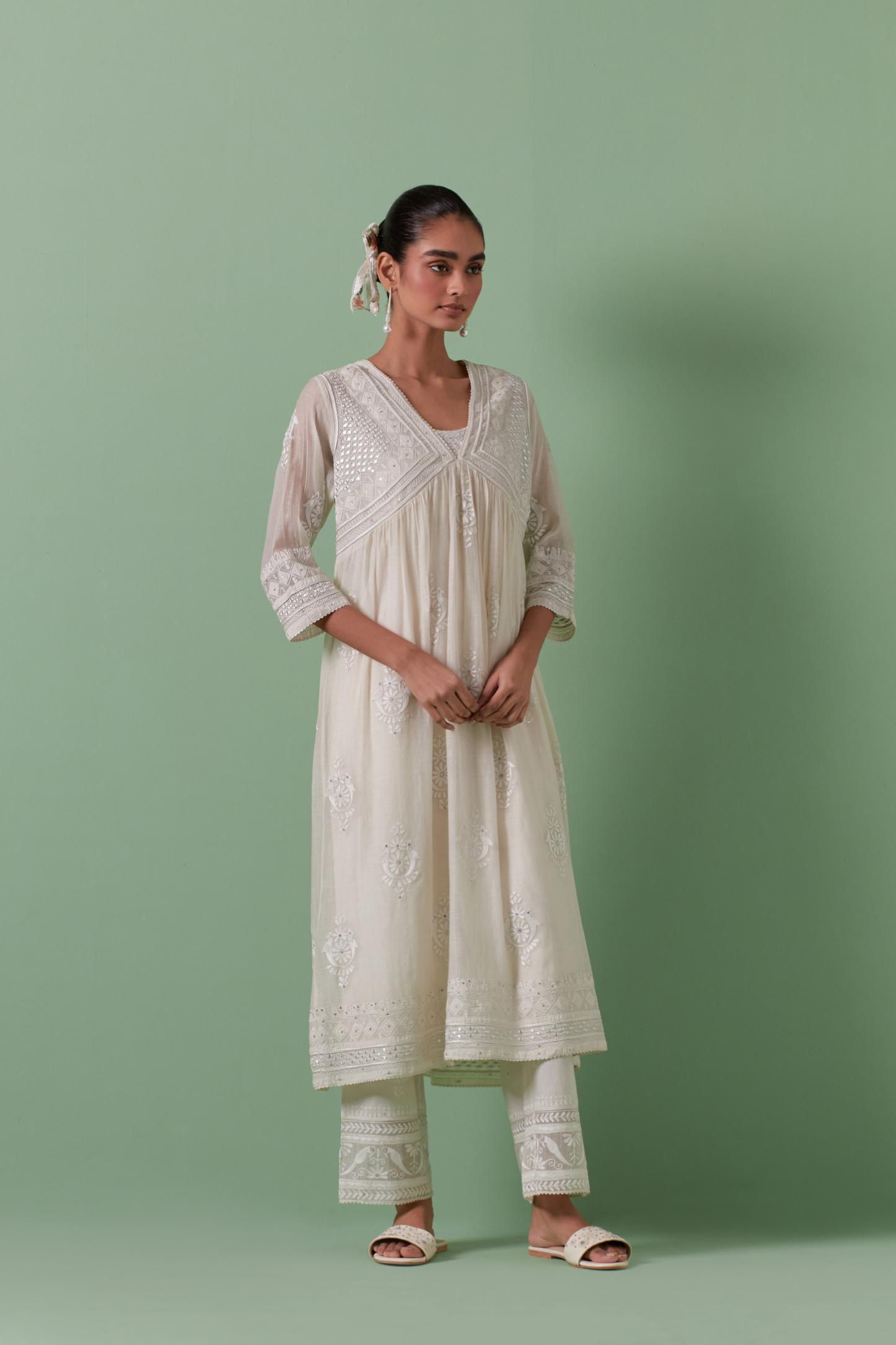Off-white cotton chanderi embroidered kurta set dress with V neck, yoke and fine gathers at empire line.