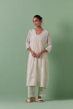 Off-white cotton chanderi embroidered kurta set dress with V neck, yoke and fine gathers at empire line.