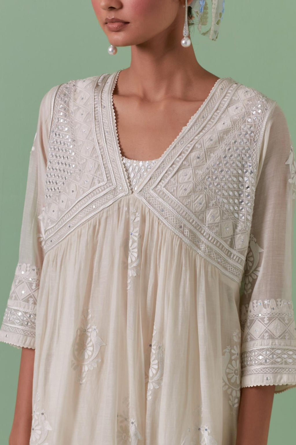 Off-white cotton chanderi embroidered kurta set dress with V neck, yoke and fine gathers at empire line.