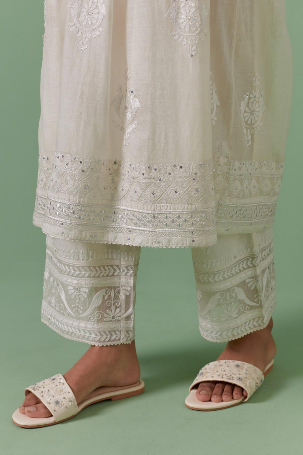 Off-white cotton chanderi embroidered kurta set dress with V neck, yoke and fine gathers at empire line.