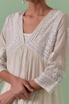 Off-white cotton chanderi embroidered kurta set dress with V neck, yoke and fine gathers at empire line.