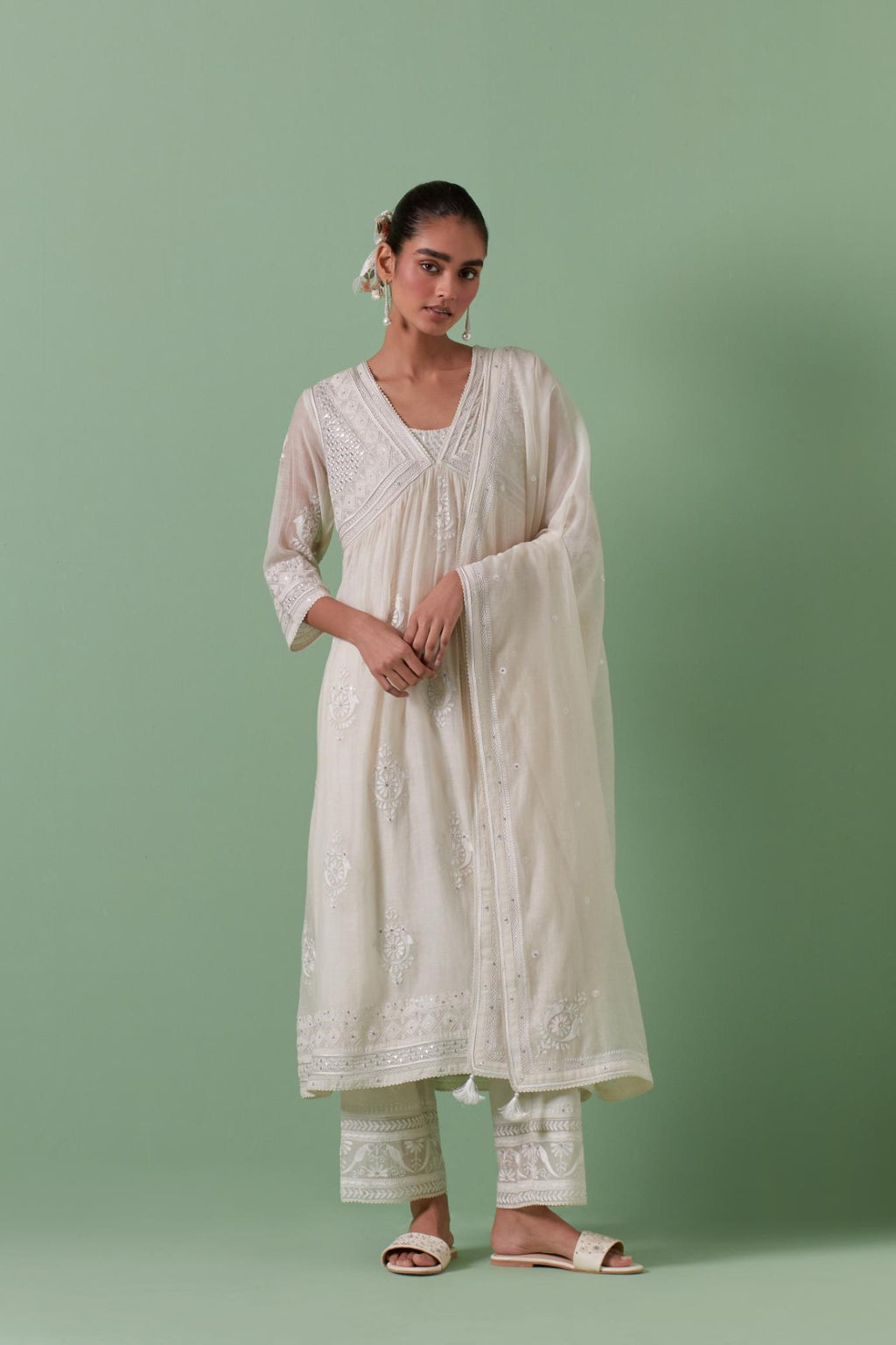 Off-white cotton chanderi dupatta with delicate silk thread embroidery, highlighted with braids, mirrors and sequins work.