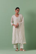 Off-white cotton chanderi embroidered kurta set dress with V neck, yoke and fine gathers at empire line.