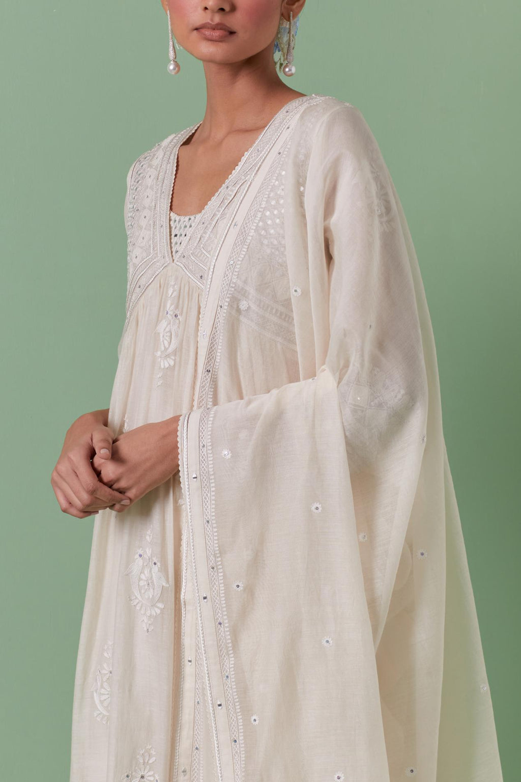 Off-white cotton chanderi embroidered kurta set dress with V neck, yoke and fine gathers at empire line.