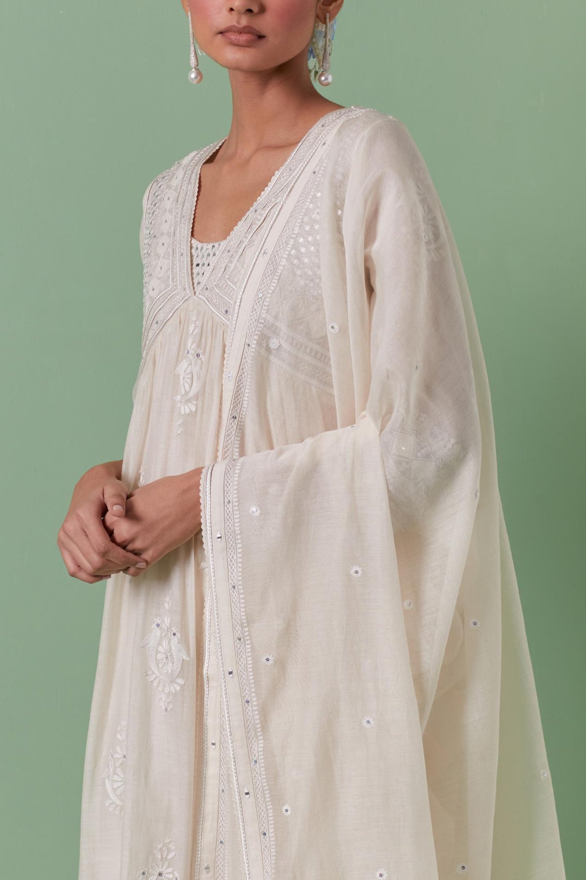 Off-white cotton chanderi embroidered kurta set dress with V neck, yoke and fine gathers at empire line.