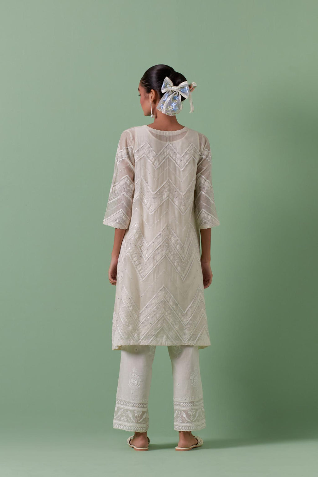 Off-white cotton chanderi A-line kurta set with all over embroidery set in bold chevron stripes.